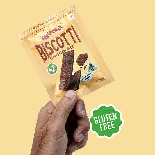 Chuckle Chocolate Biscotti gluten free chocolate biscotti snack pack held in hand
